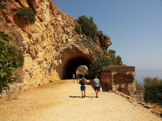 Tunnel carved into the cliffside of Lo Zingaro