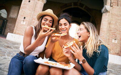 Enjoying pizza in Rome