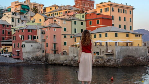 A woman taking in a view along the Italian Riviera