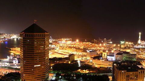 The lit up city of Genoa at night