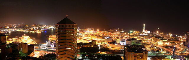 The lit up city of Genoa at night