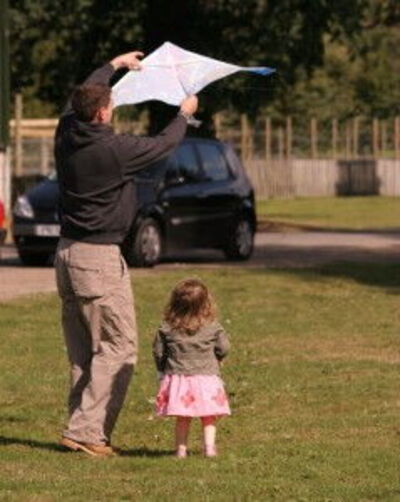 Father and daughter with a kite