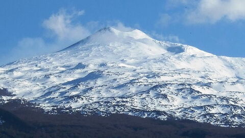 A snow covered mount etna