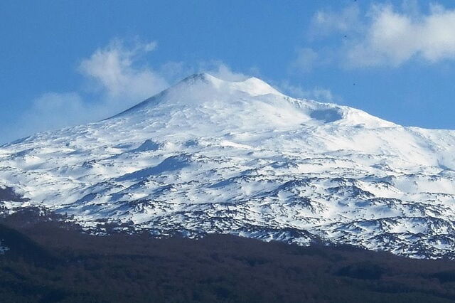 A snow covered mount etna