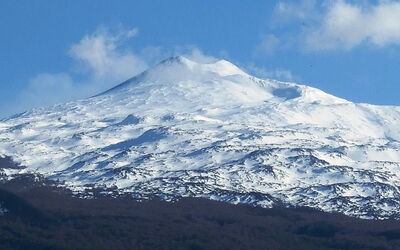 A snow covered mount etna