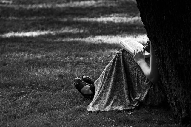 Woman reading on the grounds of the Villa Borghese