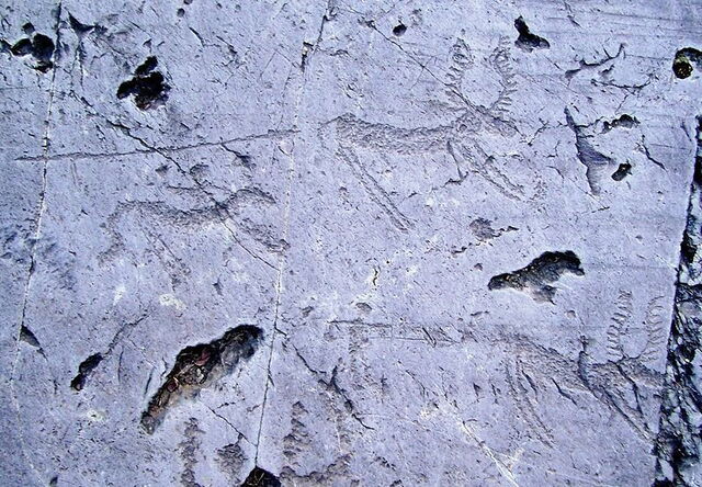 hunting scene rock carving
