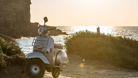 A scooter by the sea in Italy