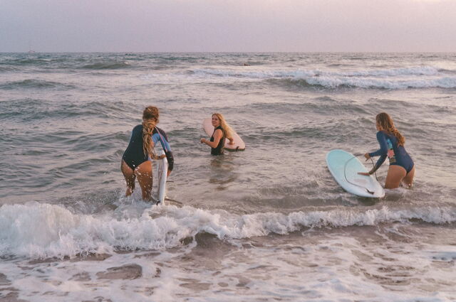 A group of women surfing