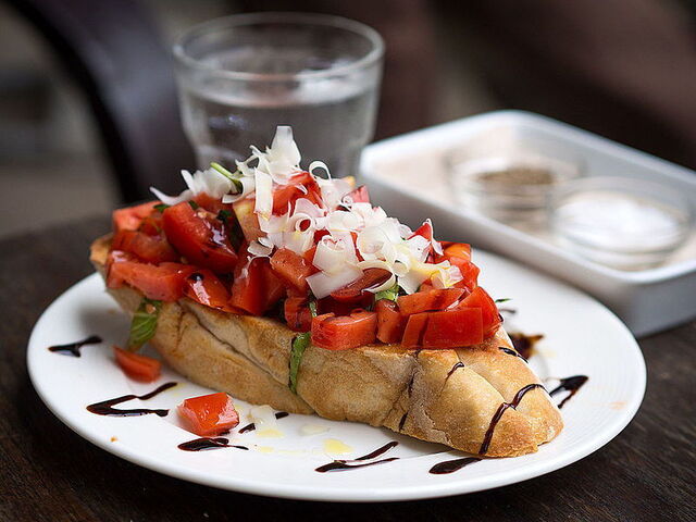 Bruschetta topped by balsamic vinegar