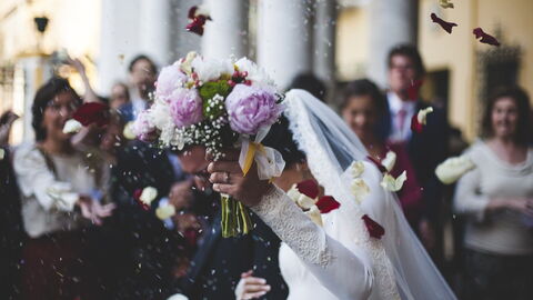 Couple leaving a wedding ceremony