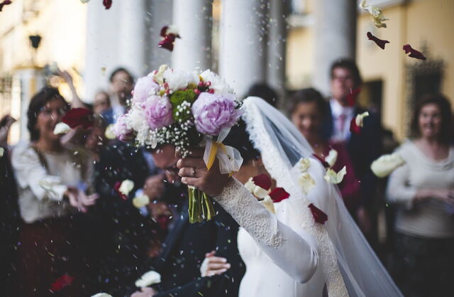 Couple leaving a wedding ceremony