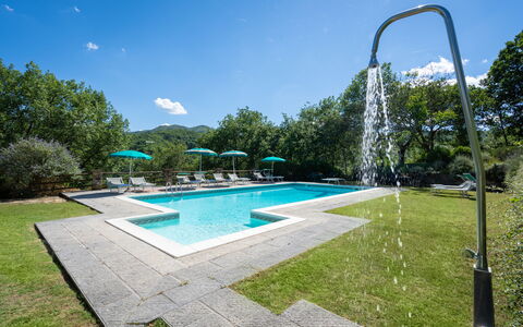 Podere Schignano: Water, Sky, Plant, Swimming Pool, Cloud, Shade, Tree, Rectangle, Outdoor Furniture, Natural Landscape