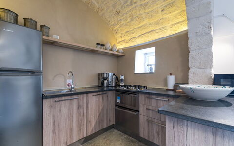 Trulli Itaka: Property, Room, Countertop, Kitchen, Building, Interior Design, Furniture, Yellow, Floor, Cabinetry
