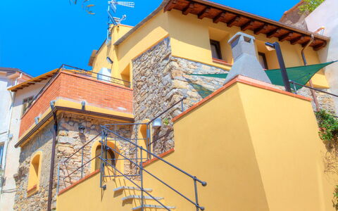 House of Stone - Deglio Faraldi: Blue, Property, House, Architecture, Building, Neighbourhood, Yellow, Wall, Real Estate, Residential Area