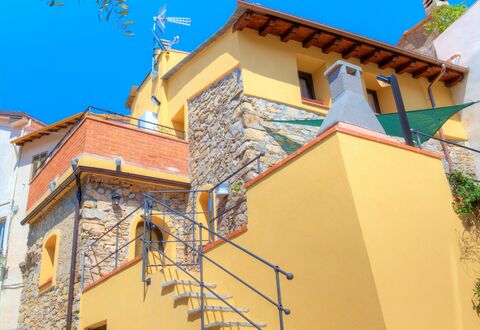 House of Stone - Deglio Faraldi: Blue, Property, House, Architecture, Building, Neighbourhood, Yellow, Wall, Real Estate, Residential Area