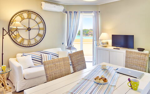 Golfo Aranci Ortensia Apartments: Room, Living Room, Furniture, Property, Interior Design, Yellow, Table, Home, Wall, Building
