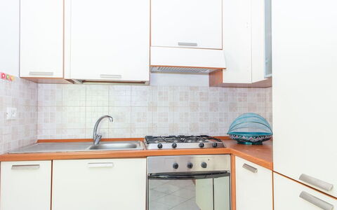 Residence Villa Smeralda: Kitchen, Kitchen Appliance, Major Appliance, Countertop, Wood, Flooring, Interior Design, Kitchen Sink, Cabinetry, Home