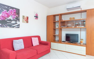 Residence Villa Smeralda 3: Property, Cabinetry, Furniture, Interior Design, Shelf, Picture Frame, Architecture, Living Room, Couch, Floor