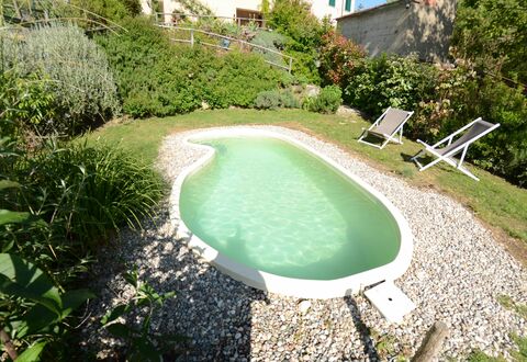 Al Colle Di Lari: Swimming Pool, Property, Natural Landscape, Grass, Water, House, Real Estate, Leisure, Estate, Landscape