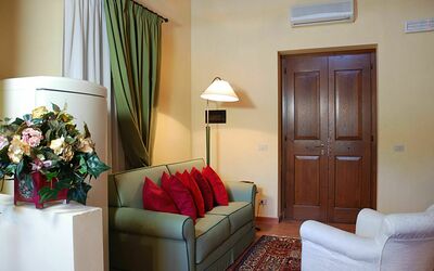 Collodi: Room, Furniture, Living Room, Interior Design, Property, Couch, Suite, Wall, Home, House