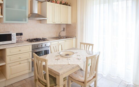 Evelyn Apartment - Diano Marina: Furniture, Property, Room, Interior Design, Building, Kitchen, Floor, Cabinetry, Table, Dining Room