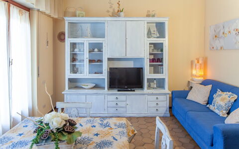 Eveten Apartments - Diano Marina: Furniture, Room, Living Room, Blue, Property, Interior Design, Wall, Home, Building, Yellow