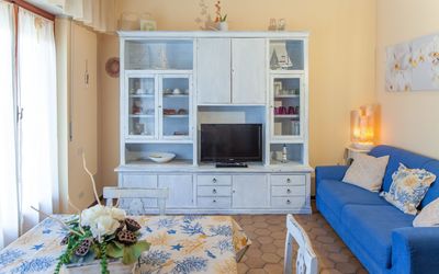 Eveten 10 Apartment: Furniture, Room, Living Room, Blue, Property, Interior Design, Wall, Home, Building, Yellow