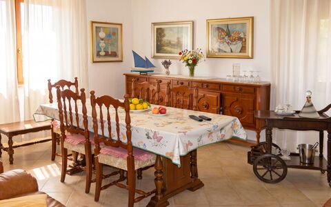Lia: Furniture, Interior Design, Table, Flooring, Wood, Floor, Room, Lighting, Dining Room, Picture Frame