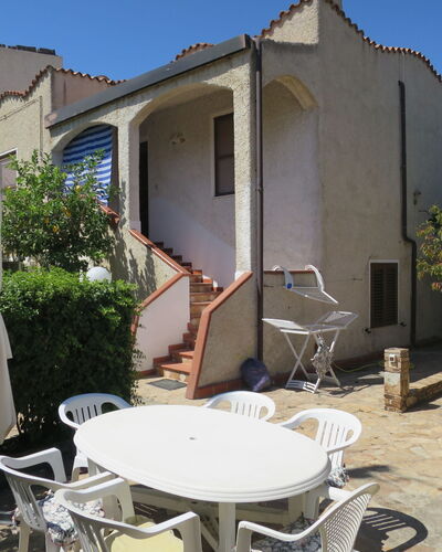Lia: Building, Property, Plant, Sky, Table, Shade, Chair, Interior Design, Window, Outdoor Furniture