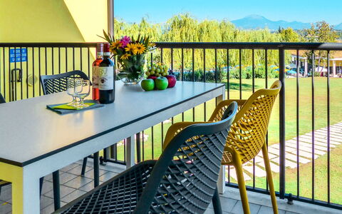 Peschiera del Garda 652: Table, Flower, Furniture, Sky, Plant, Flowerpot, Blue, Outdoor Table, Chair, Interior Design