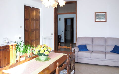 Emilia: Furniture, Interior Design, Wood, Flooring, Floor, Room, Table, Ceiling, Lighting, Living Room