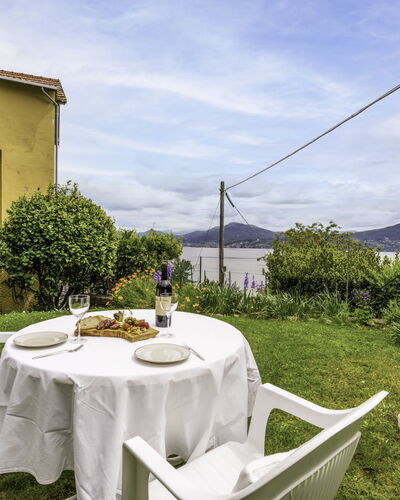 Morandi: Cloud, Sky, Property, Plant, Table, White, Tableware, Chair, Tablecloth, Building