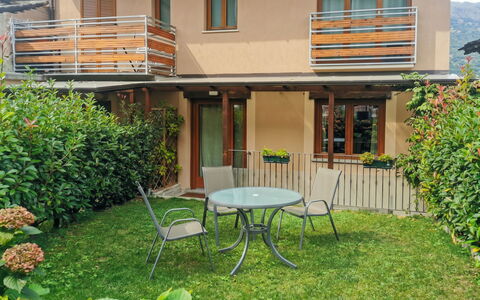 La Maison D'Amelie: Shade, Garden, Outdoor Table, Yard, Outdoor Furniture, Backyard, Lawn, Wood Stain, Chair, Balcony