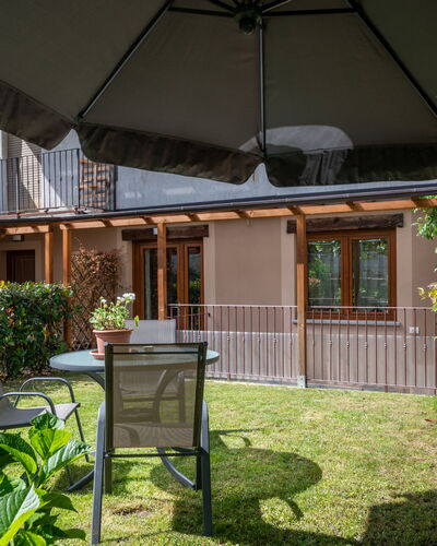 La Maison D'Amelie: Plant, Building, Umbrella, Shade, Table, Grass, Residential Area, Outdoor Furniture, Wood, Real Estate