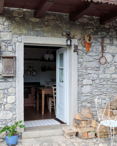 Casa Lienartova: Plant, Building, Flowerpot, Wood, Houseplant, Chair, Brick, Door, Brickwork, Facade