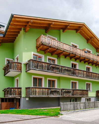 Pozza di Fassa 653: Building, Wheel, Property, Sky, Cloud, Window, Vehicle, Car, Urban Design
