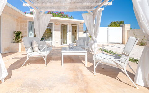 Villa Niraclo': Table, Furniture, Couch, Plant, Building, Outdoor Furniture, Shade, Chair, Comfort, Porch
