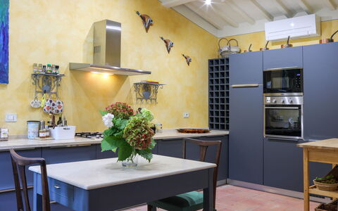 Villa Bacco: Furniture, Interior Design, Flooring, Kitchen, Wood, Countertop, Floor, Kitchen Appliance, Home, Lighting