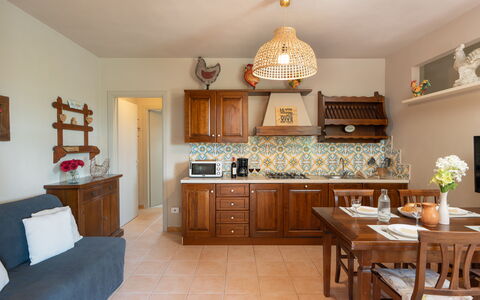 Calanchi Apartments: Furniture, Interior Design, Wood, Flooring, Cabinetry, Ceiling, Floor, Room, Lighting, Kitchen