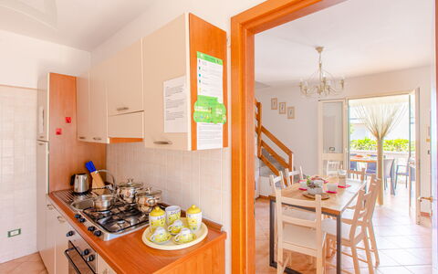 Villa Orchidea: Room, Property, Yellow, Kitchen, Orange, Furniture, Building, House, Real Estate, Interior Design