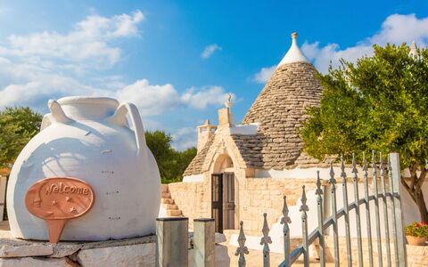 Trullo Del Mandarino: Sky, Historic Site, Tourism, House, Architecture, Vacation, Building