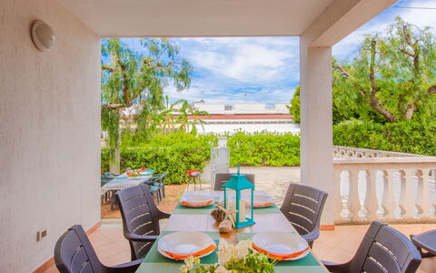 Villa Mezzaluna: Property, Room, Real Estate, House, Building, Interior Design, Porch, Table, Vacation, Furniture