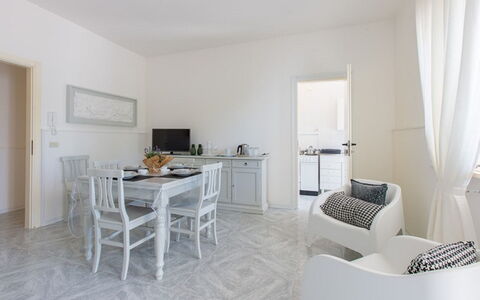 Villa Nettuno: White, Room, Property, Furniture, Interior Design, Building, House, Living Room, Floor, Table