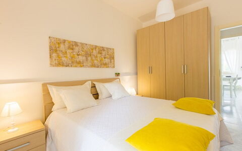 Villa Nettuno: Bedroom, Bed, Room, Furniture, Property, Interior Design, Bed Sheet, Yellow, Bed Frame, Building
