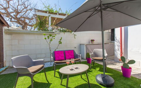 Casa Rosa: Property, Patio, Backyard, Yard, House, Umbrella, Furniture, Grass, Table, Building
