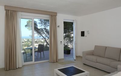 Villa Eos: Furniture, Couch, Wood, Comfort, Interior Design, Shade, Studio Couch, Floor, Living Room