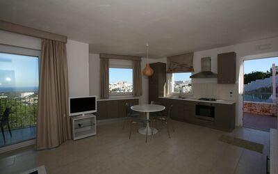 Villa Zeus: Furniture, Couch, Table, Building, Television, Wood, Living Room, Flooring, Shade, Floor