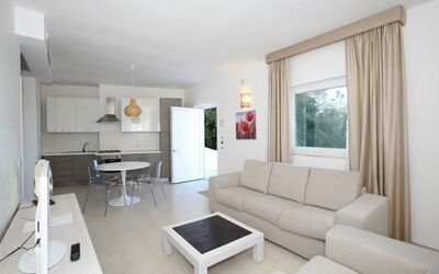 Villa Ecate: Table, Property, Couch, Furniture, Comfort, Living Room, Wood, Studio Couch, Building, Picture Frame