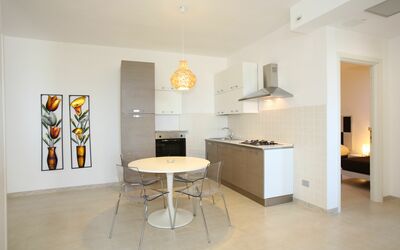 Villa Rea: Furniture, Table, Wood, Interior Design, Floor, Flooring, Beige, Living Room, Hall, Countertop